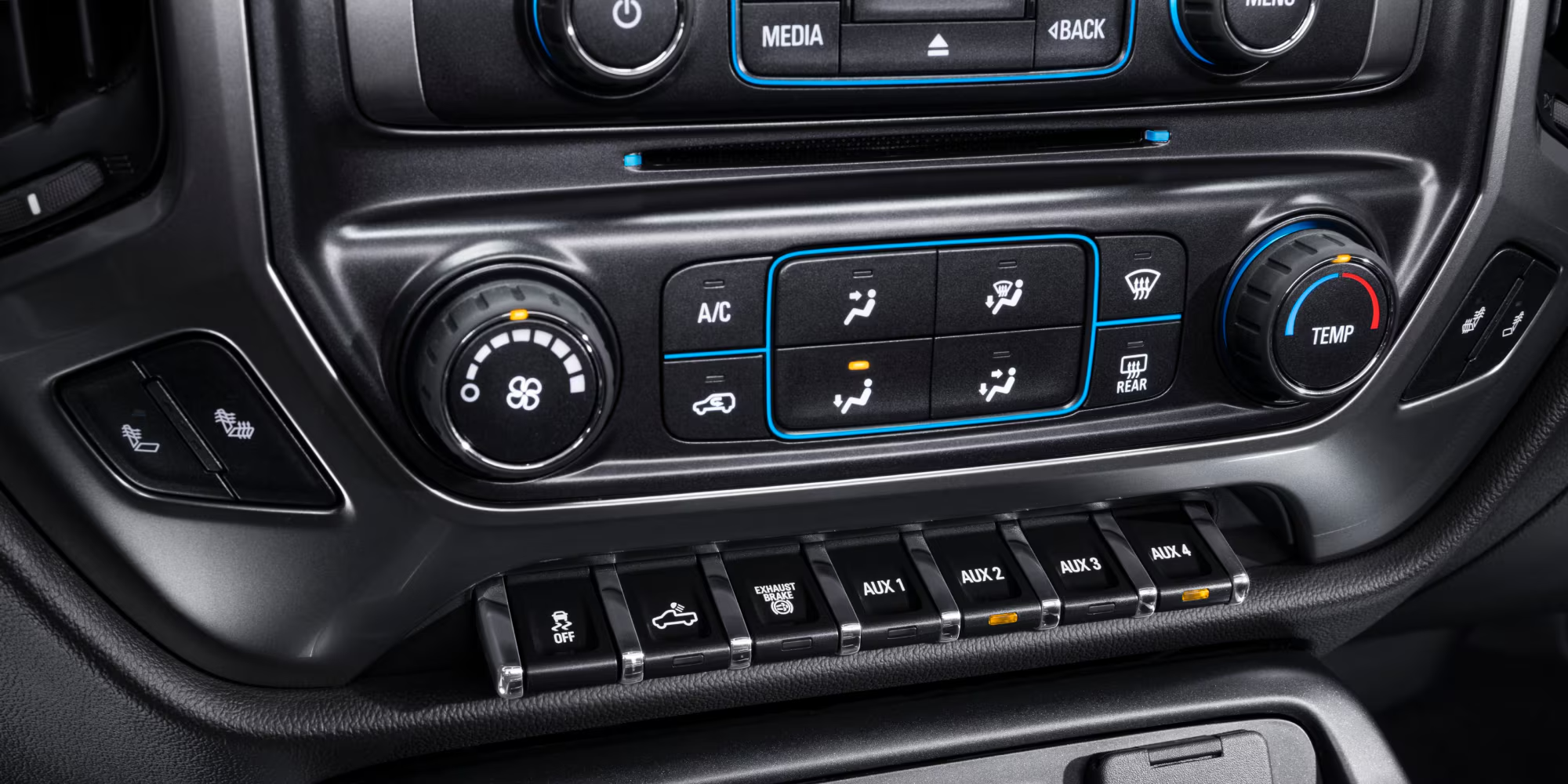 Row of auxiliary upfitter switches on the dashboard of a Chevy Silverado 4500HD