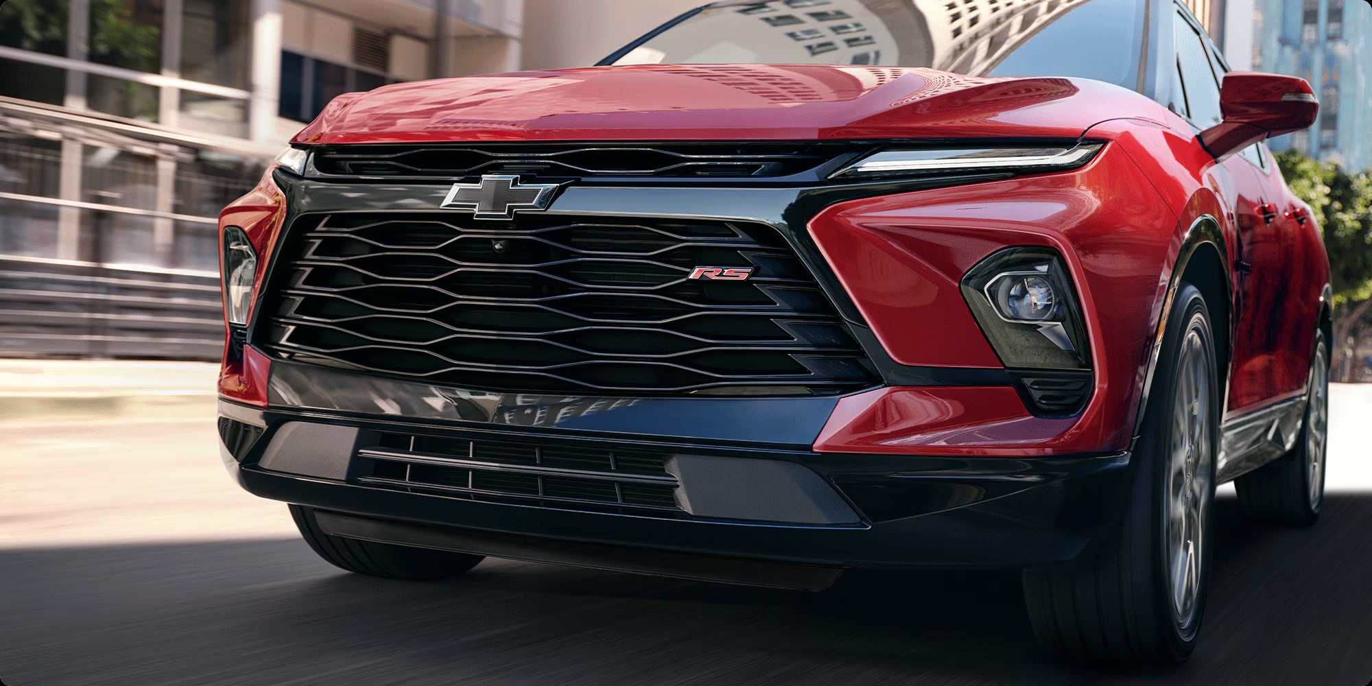 Close-up of the red Chevy Blazer RS front end with black grille and RS badge