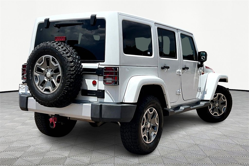 Used 2014 Jeep Wrangler Unlimited Sahara with VIN 1C4BJWEG9EL219849 for sale in Colorado Springs, CO