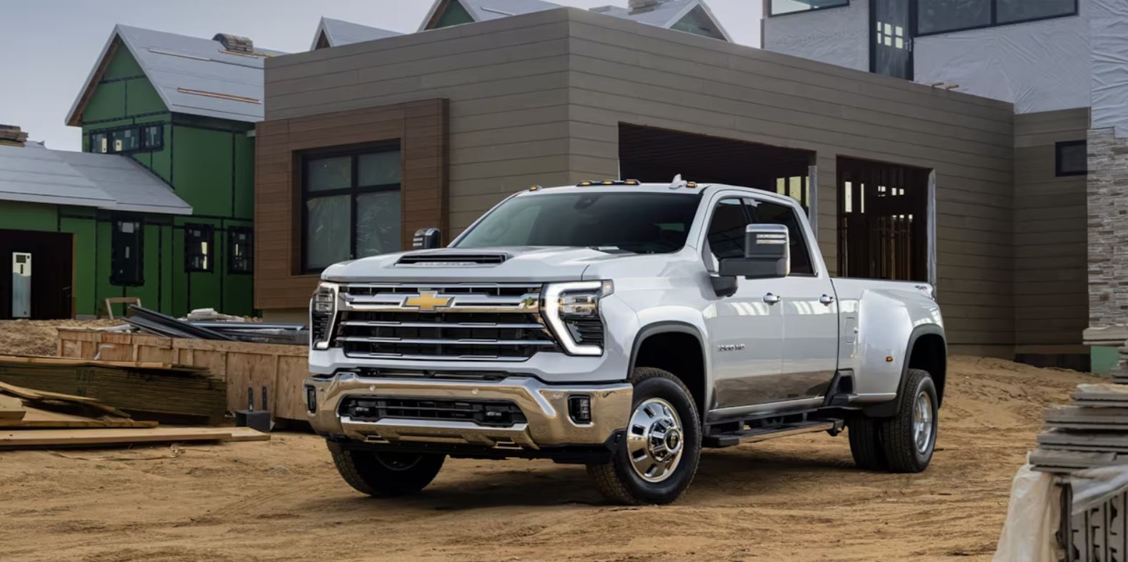 A Chevy Silverado HD sitting outside of a construction site.