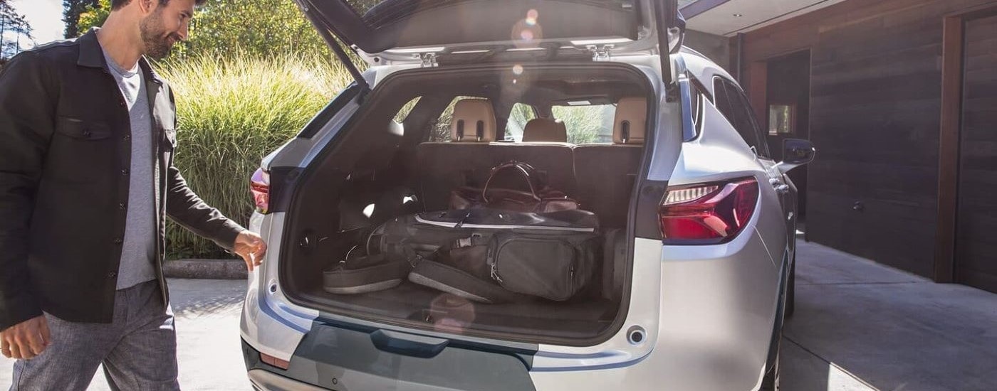 A close up shows luggage in the trunk of a silver 2022 Chevy Blazer.