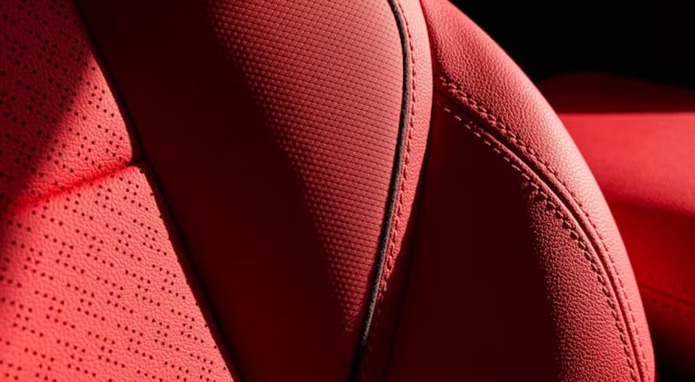 A close up of the stitching on the red interior of a 2024 Chevy Blazer EV SS is shown.