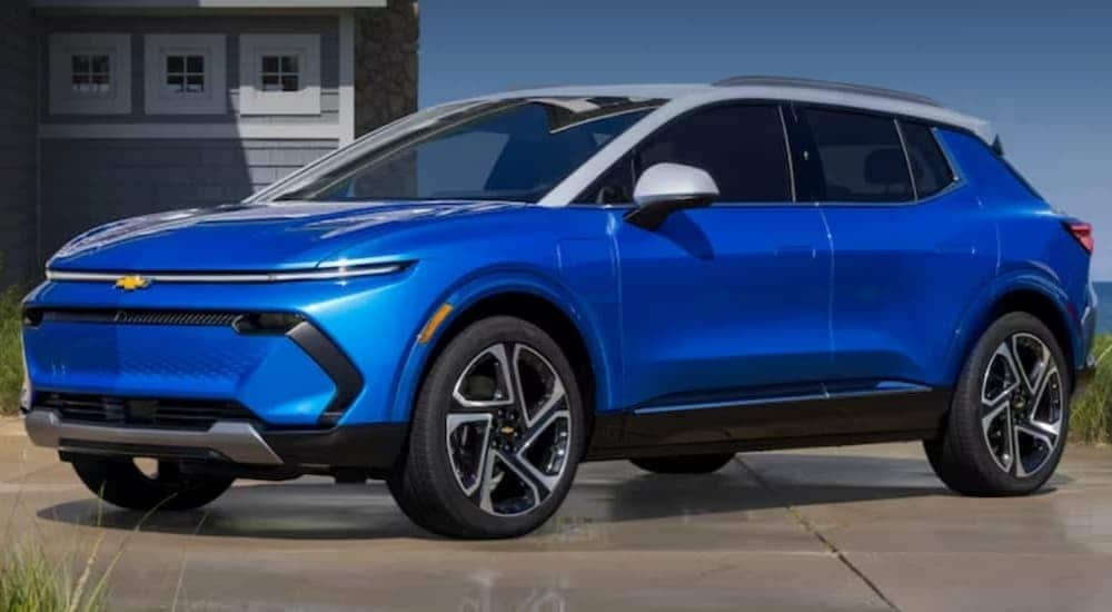 A blue 2024 Chevy Equinox EV is shown parked near a Chevy dealer near Canal Winchester.