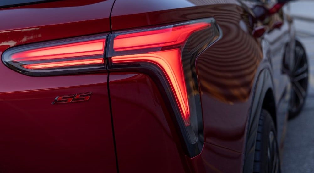 A close up shows the passenger side taillight on a red 2024 Chevy Blazer EV SS.