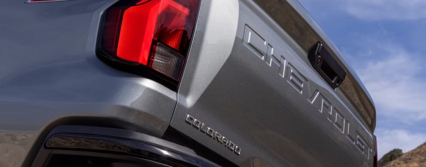 A close up shows the tailgate on a silver 2023 Chevy Colorado.