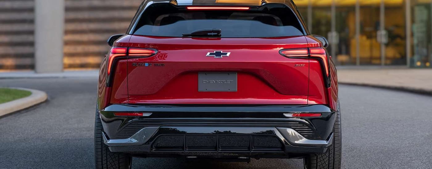 A red 2024 Chevy Blazer EV SS is shown in the rear parked in an empty lot near Columbus, OH.
