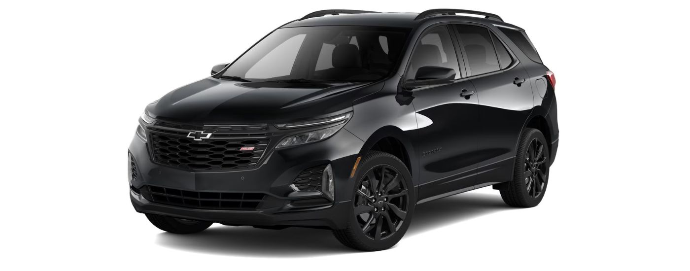 A black 2024 Chevy Equinox RS is angled left.
