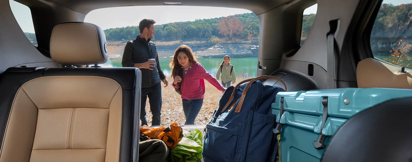 Cargo is shown in the trunk of a 2023 Chevy Equinox.
