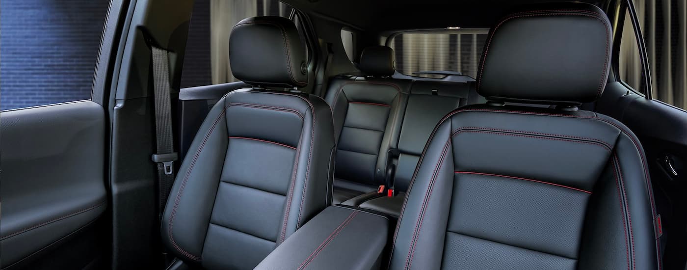 The black leather interior is shown in a 2023 Chevy Equinox RS.