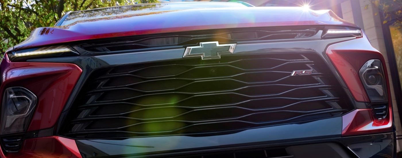 A close up shows the grille on a red 2023 Chevy Blazer RS.