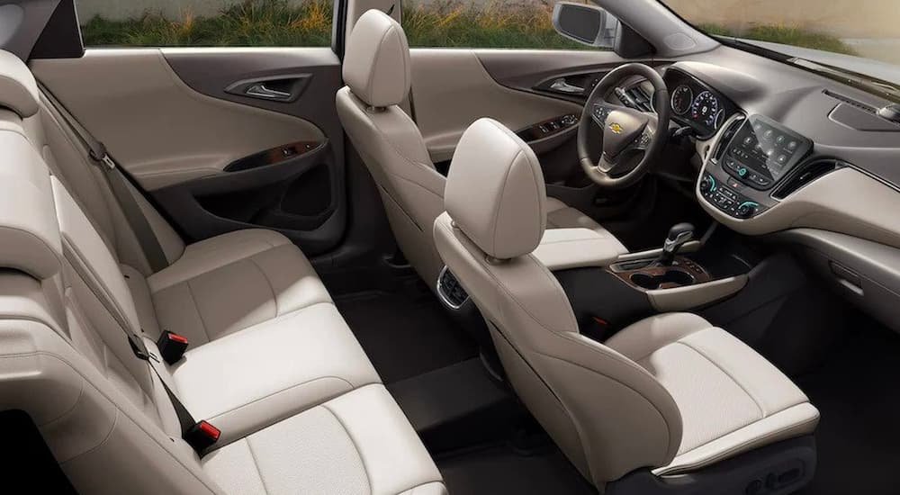 The cream interior is shown in a 2023 Chevy Malibu.
