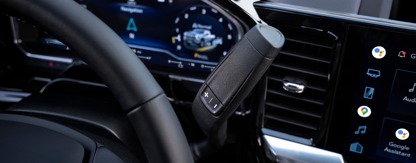 A close-up shows the black interior and details in a 2025 Chevy Silverado 2500 HD High Country.