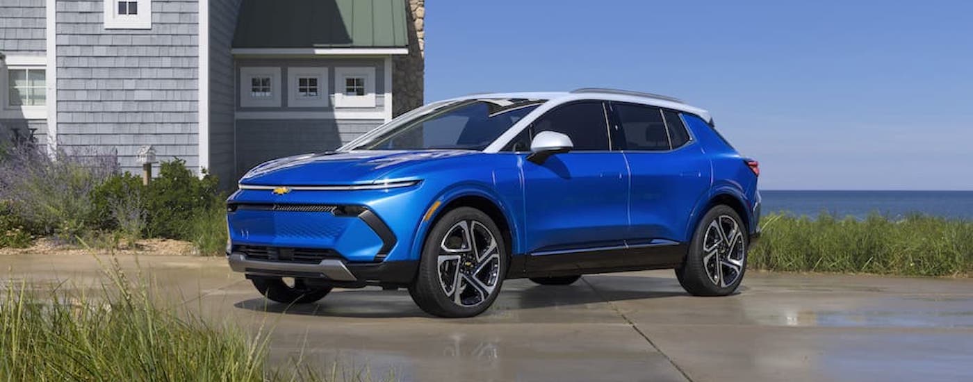 A blue 2025 Chevy Equinox EV is shown from the front at an angle.