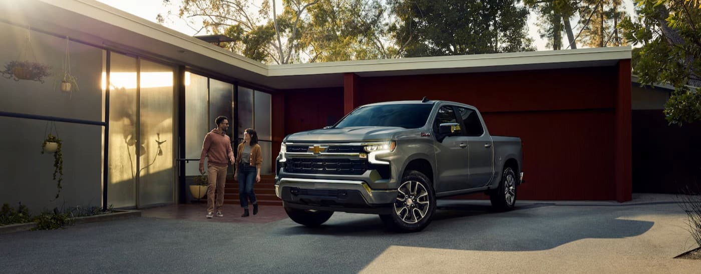 A silver 2025 Chevy Silverado 1500 Z71 is parked on a driveway.