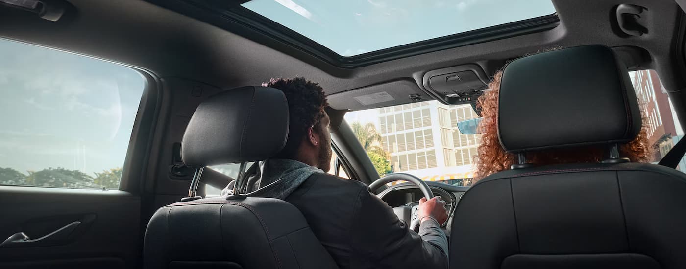 Two people are driving in a 2025 Chevy Blazer.