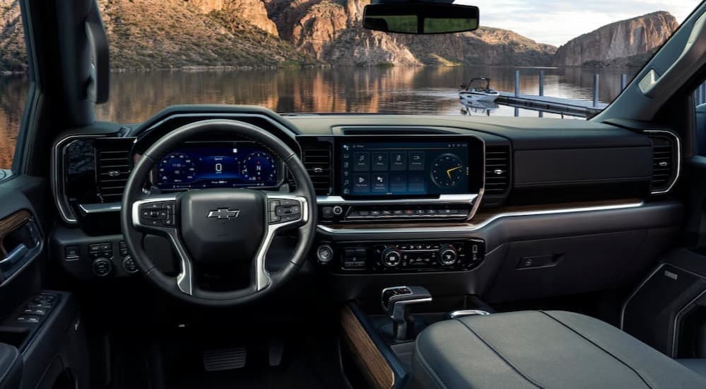 The black interior and dash are shown in a 2025 Chevy Silverado 1500 for sale in Columbus.