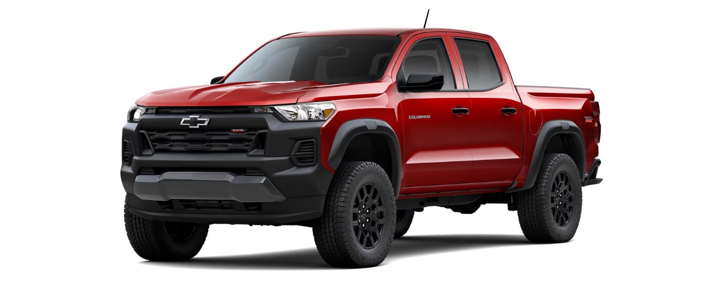 A red 2024 Chevy Colorado Trail Boss is angled left.