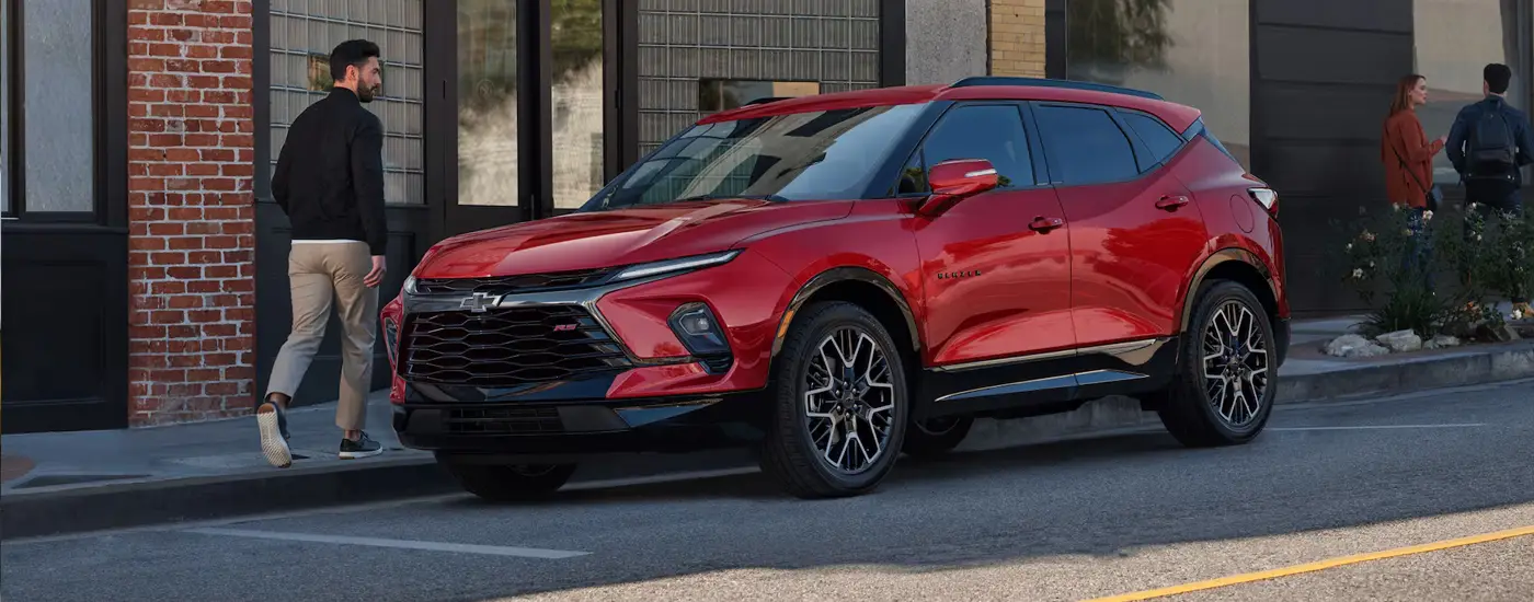 2026 Chevy Blazer Man walking around it - buy at Dave Gill Chevy