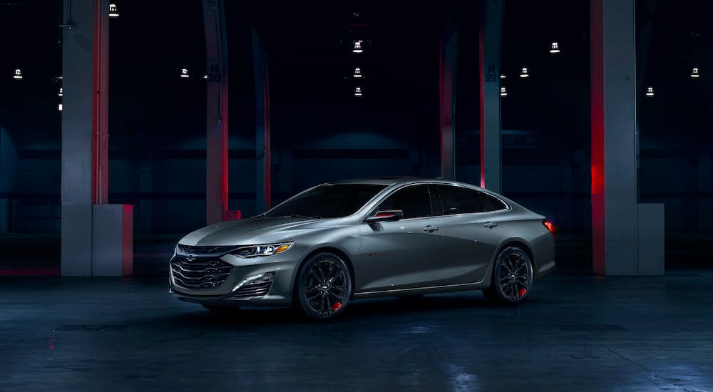 A silver 2024 Chevy Malibu Redline Edition is shown from the side.