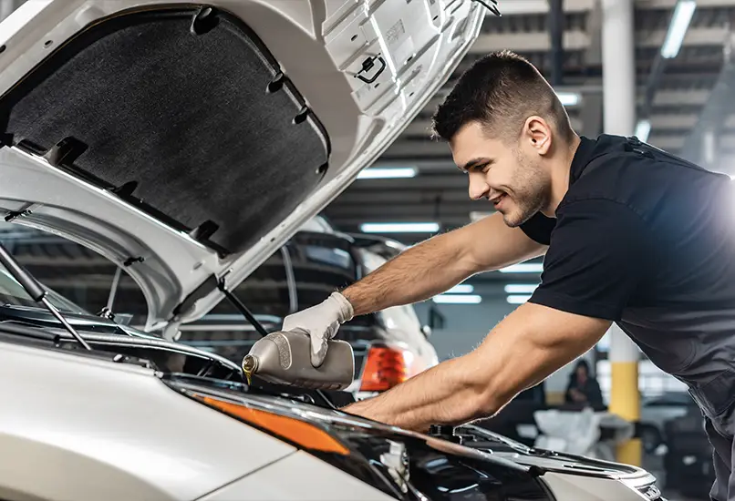 Dave Gill Chevrolet certified technician working on a vehicle in the service bay in Columbus, OH