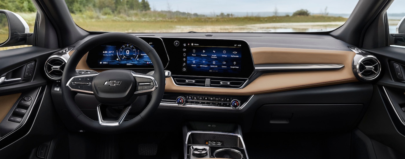 The tan interior of a 2025 Chevy Equinox ACTIV is shown from above the center console after leaving a dealer that has a Chevy Equinox for sale in Columbus.