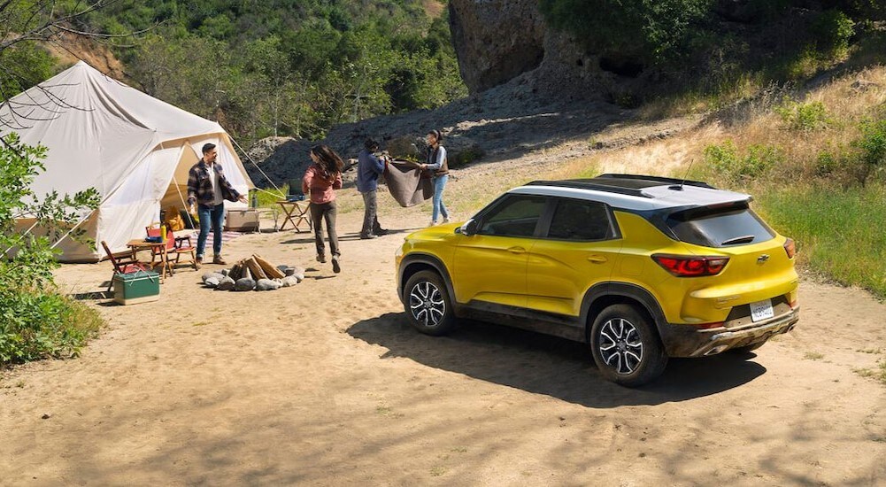 A yellow 2025 Chevy Trailblazer ACTIV is shown parked on a cmpsite.