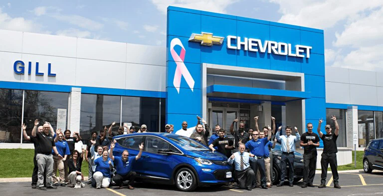 Dave Gill Chevrolet dealership team and showroom on East Broad Street in Columbus, Ohio - family-owned since 1982
