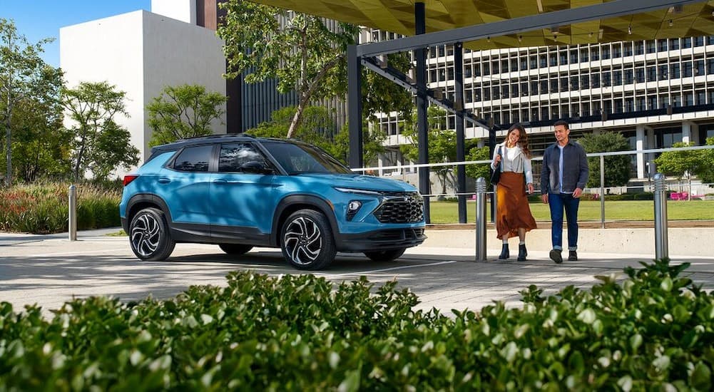 A blue 2025 Chevy Trailblazer RS is shown parked near a Chevy dealer near New Albany.
