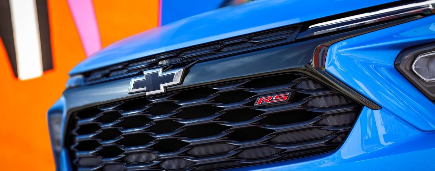 Close-up on the grille of a blue 2024 Chevy Trailblazer RS.