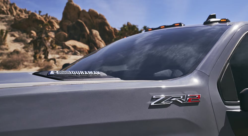 Close-up of the hood of a grey 2025 Chevy Silverado 2500 HD ZR2.