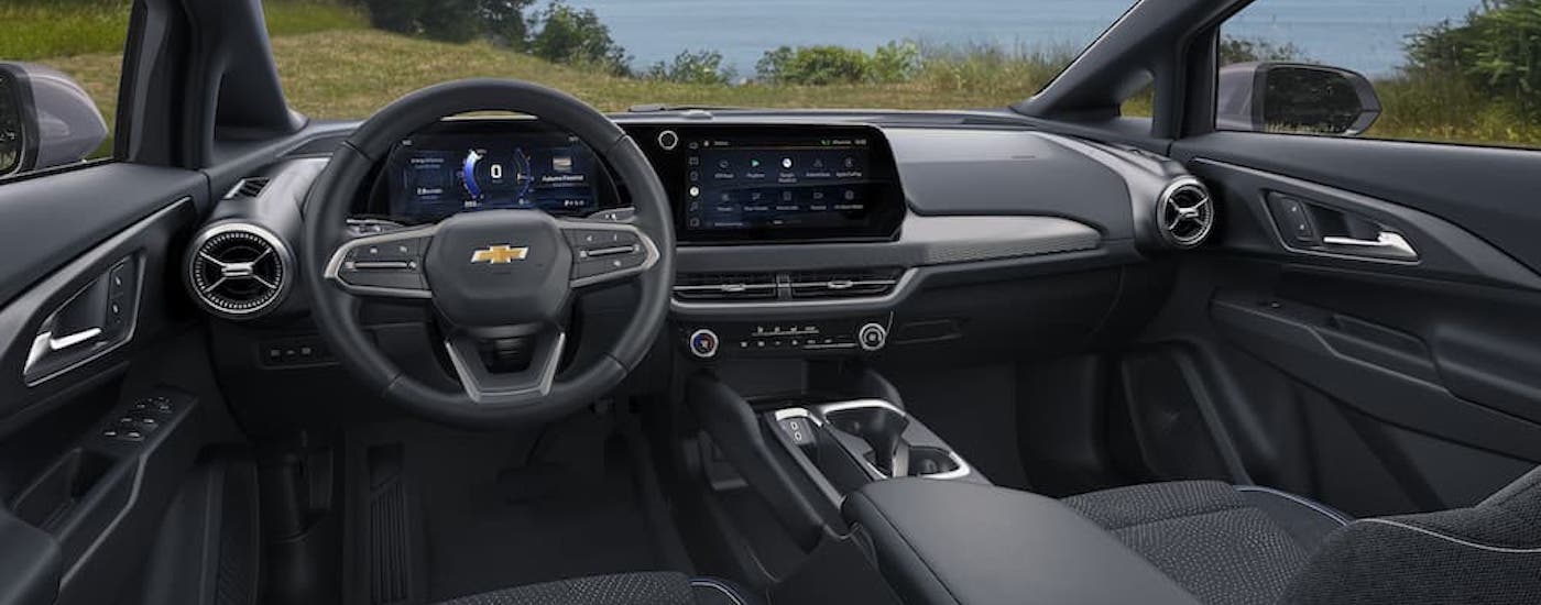 The black interior of a 2025 Chevy Equinox EV is shown.