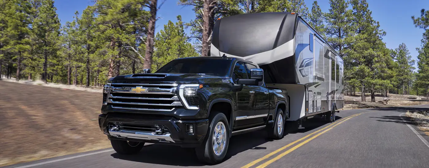 Chevy Silverado 2500 HD pulling a trailer - Dave Gill Chevy