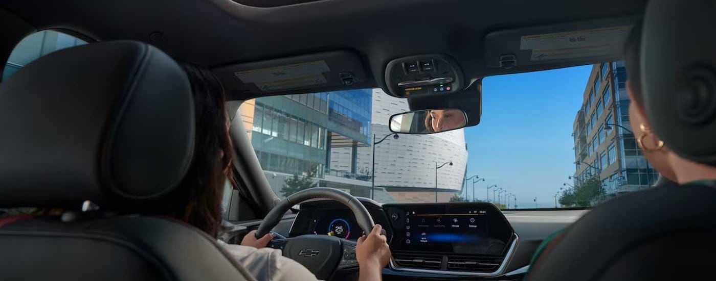 The black interior and dash are shown in a 2025 Chevy Trax.
