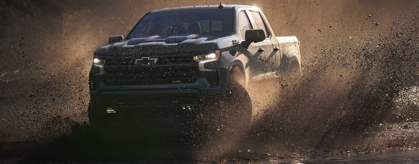 2026 Chevy Silverado 1500 driving through the mud - for sale at Dave Gill Chevy