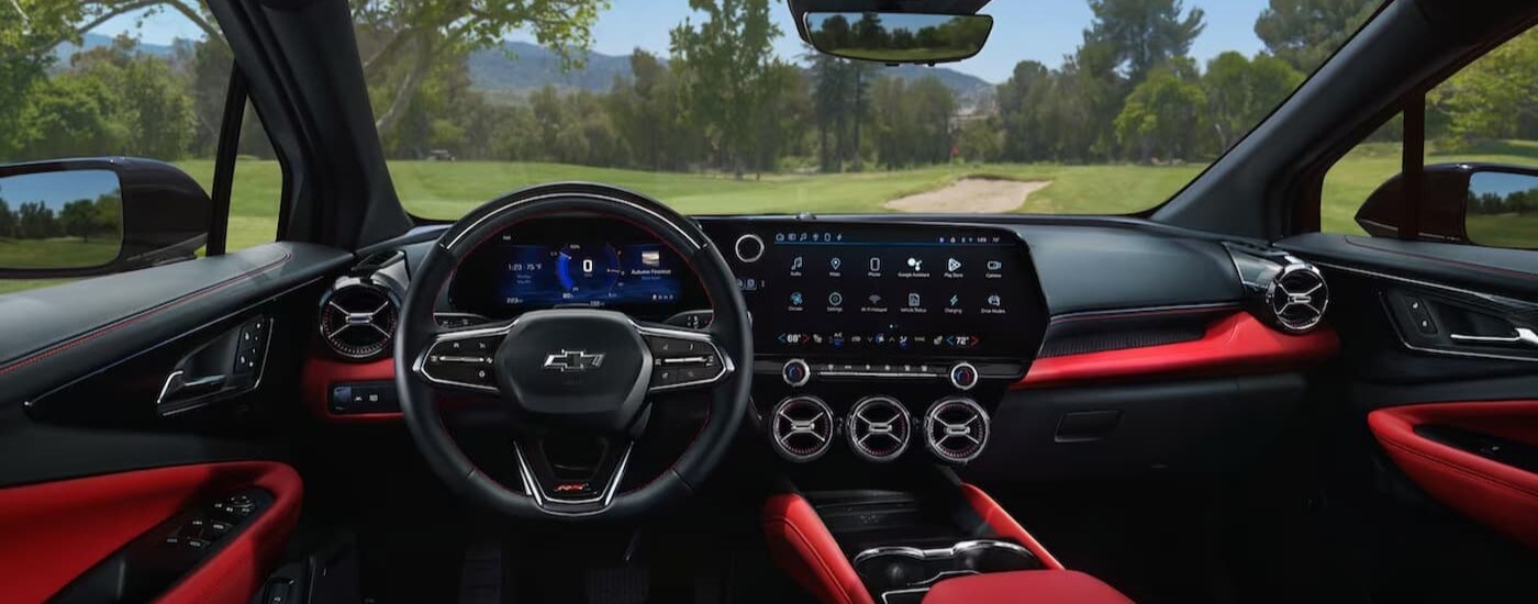 The black and red interior and dash in a 2024 Chevy Blazer EV RS is shown.