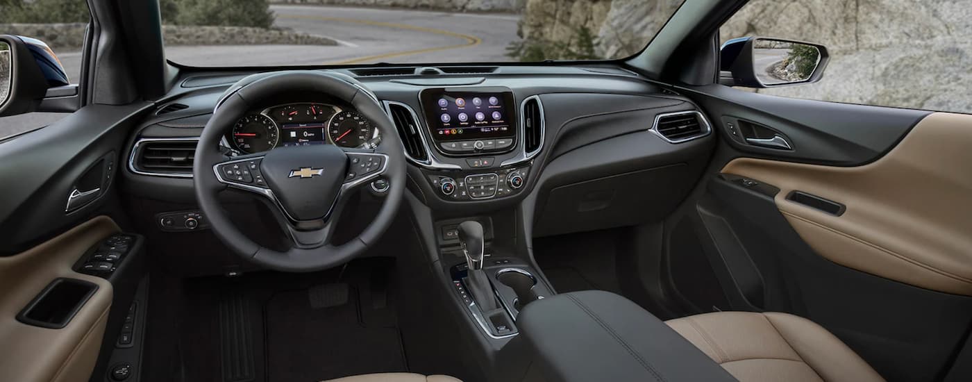The black and brown interior of a 2022 Chevy Equinox is shown.