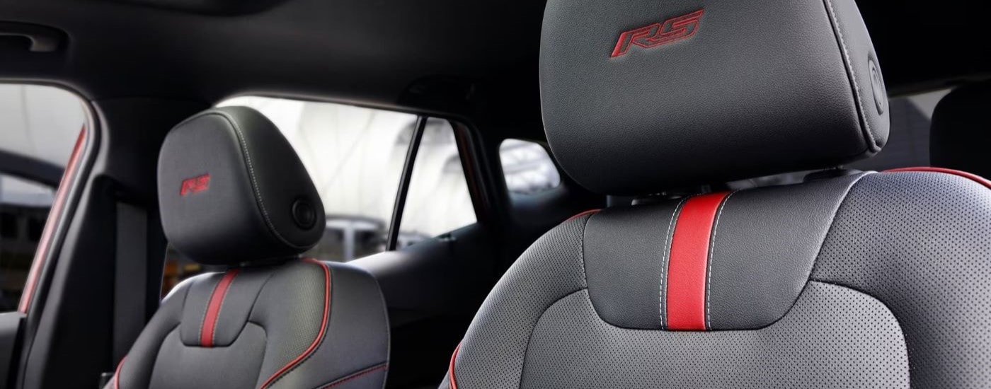 A close up shows the front black leather seats in a 2024 Chevy Trax RS.