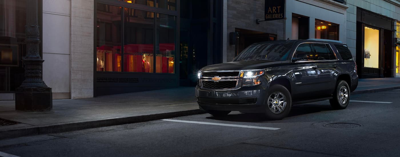 A black 2020 Chevy Tahoe is shown on a city street after leaving a Chevy dealer in Whitehall.