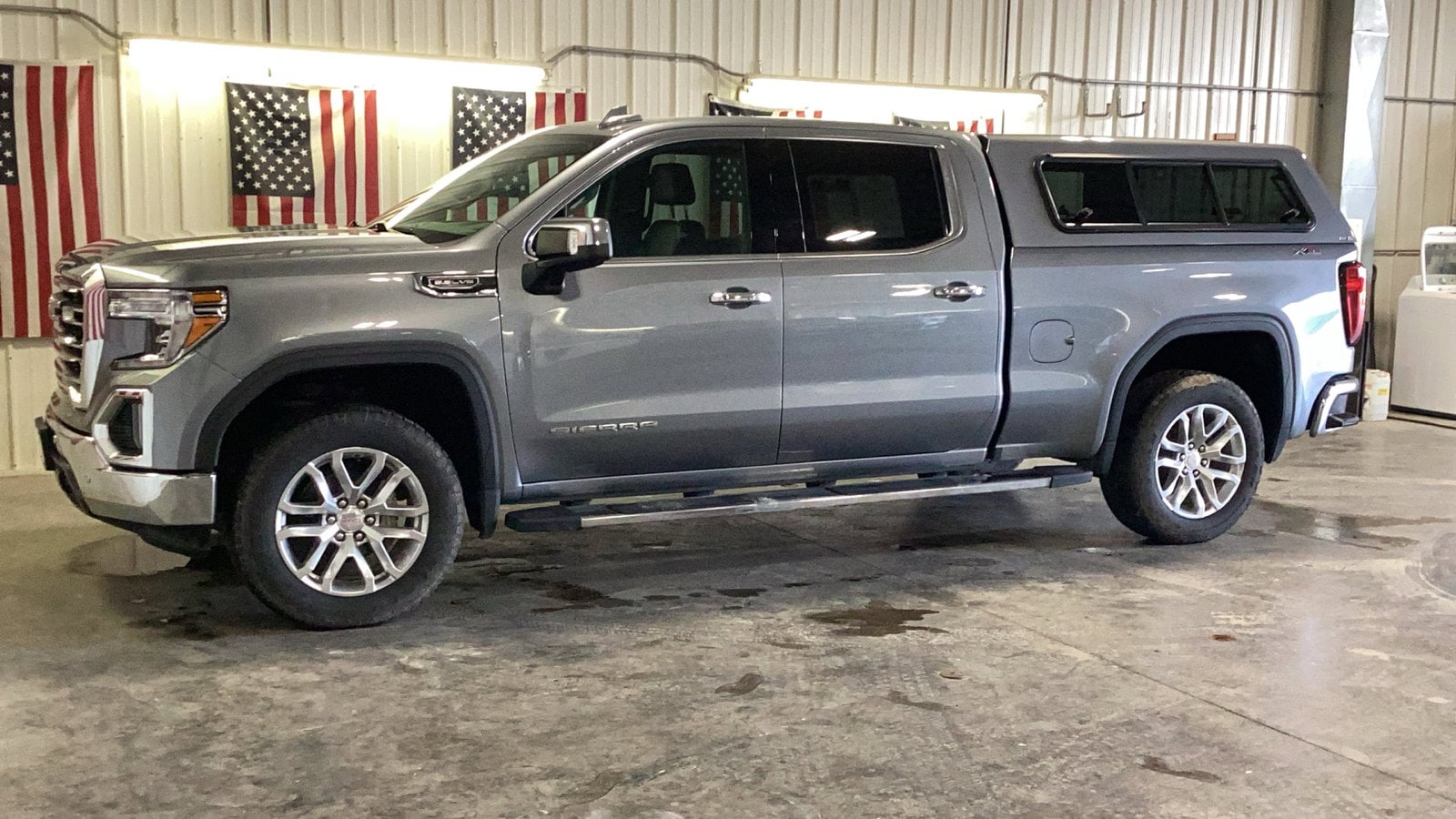 Used 2021 GMC Sierra 1500 SLT with VIN 1GTU9DED3MZ215500 for sale in Delano, Minnesota