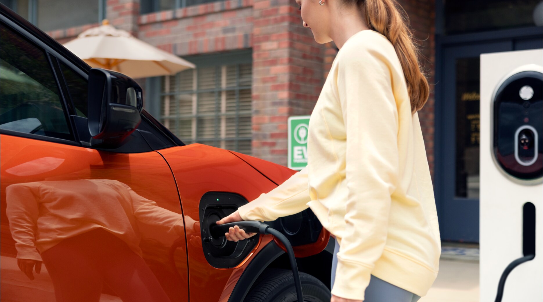 Person cheerfully signing documents.