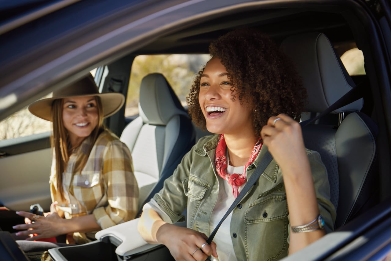 Person cheerfully signing documents.