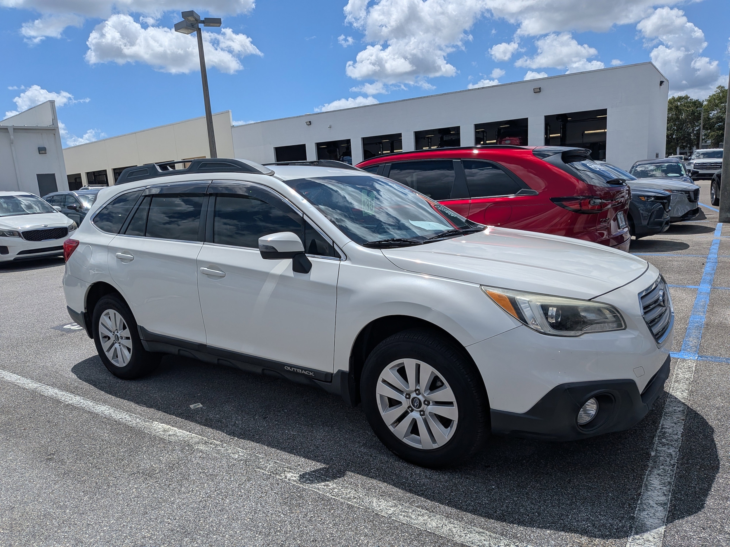 Used 2016 Subaru Outback Premium with VIN 4S4BSBFCXG3209038 for sale in Daytona Beach, FL