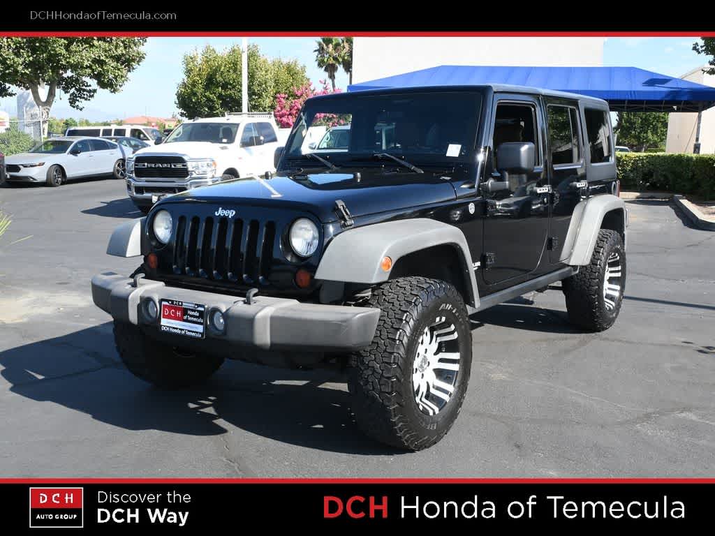 2011 Jeep Wrangler Unlimited Rubicon — photo 1 of 24