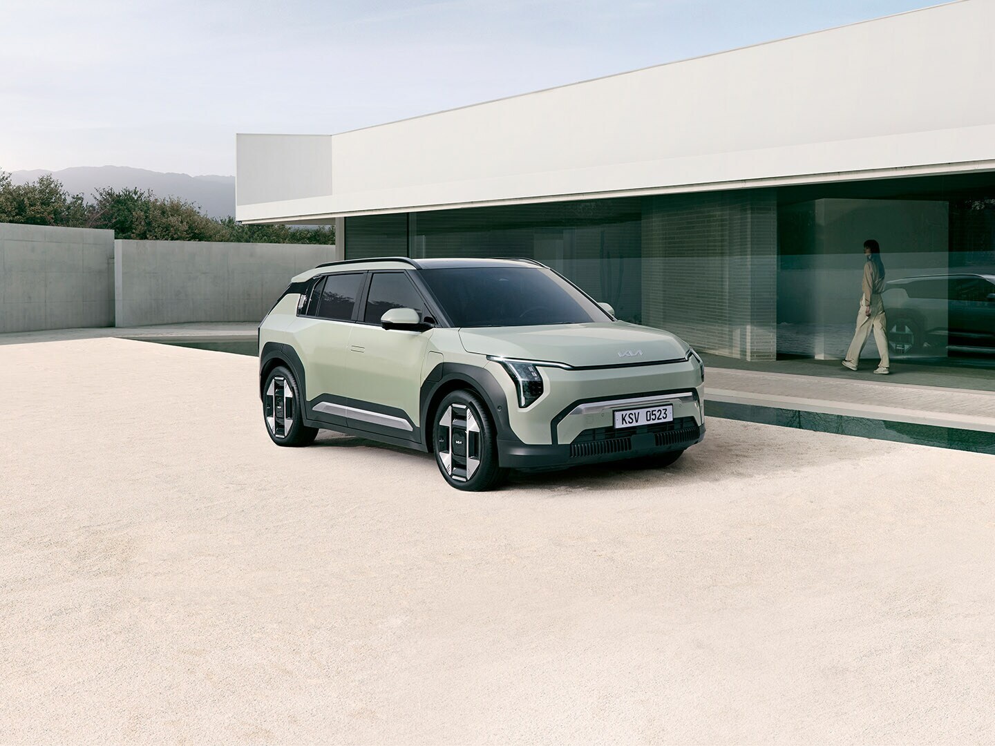 silver EV6 GT all-electric SUV parked on cracked desert pavement