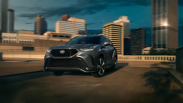dark Gray used Toyota driving through a city