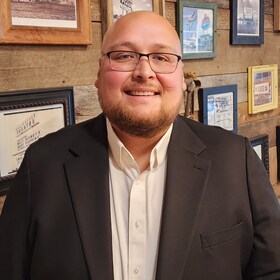 Staff member Caleb De La Rosa from 66b2877bc4e7