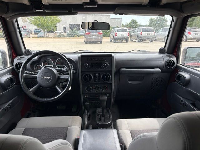 Used 2010 Jeep Wrangler Unlimited Sport with VIN 1J4BA3H16AL198615 for sale in Iowa City, IA