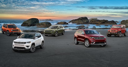 New Jeep, Ram, and Dodge vehicles displayed on a dealership lot in Southern California