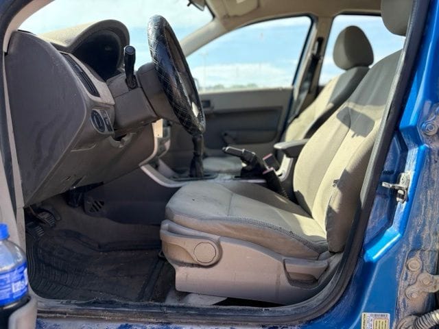 Used 2010 Ford Focus S with VIN 1FAHP3ENXAW148018 for sale in Iowa City, IA