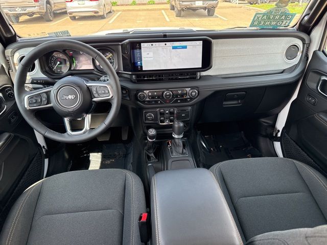 Used 2025 Jeep Wrangler 4xe Sahara 4XE with VIN 1C4RJXP69SW600992 for sale in Iowa City, IA